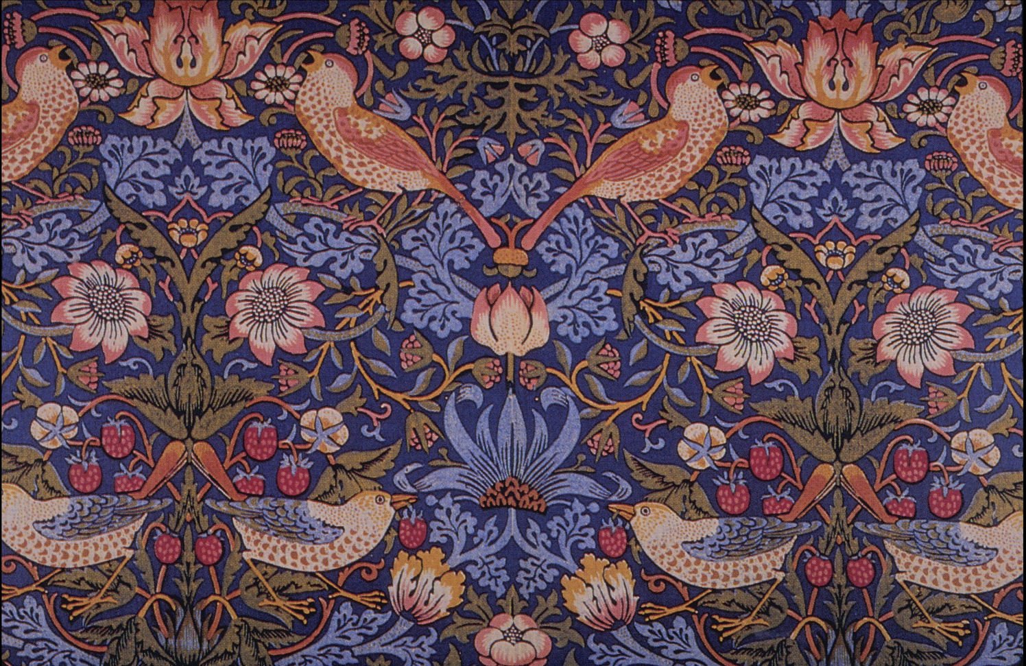 William Morris's Strawberry Thief pattern — coral-colored thrushes carrying strawberries in their beaks against a deep indigo ground, woven through cobalt scrollwork and roses in a mirrored, all-over repeat