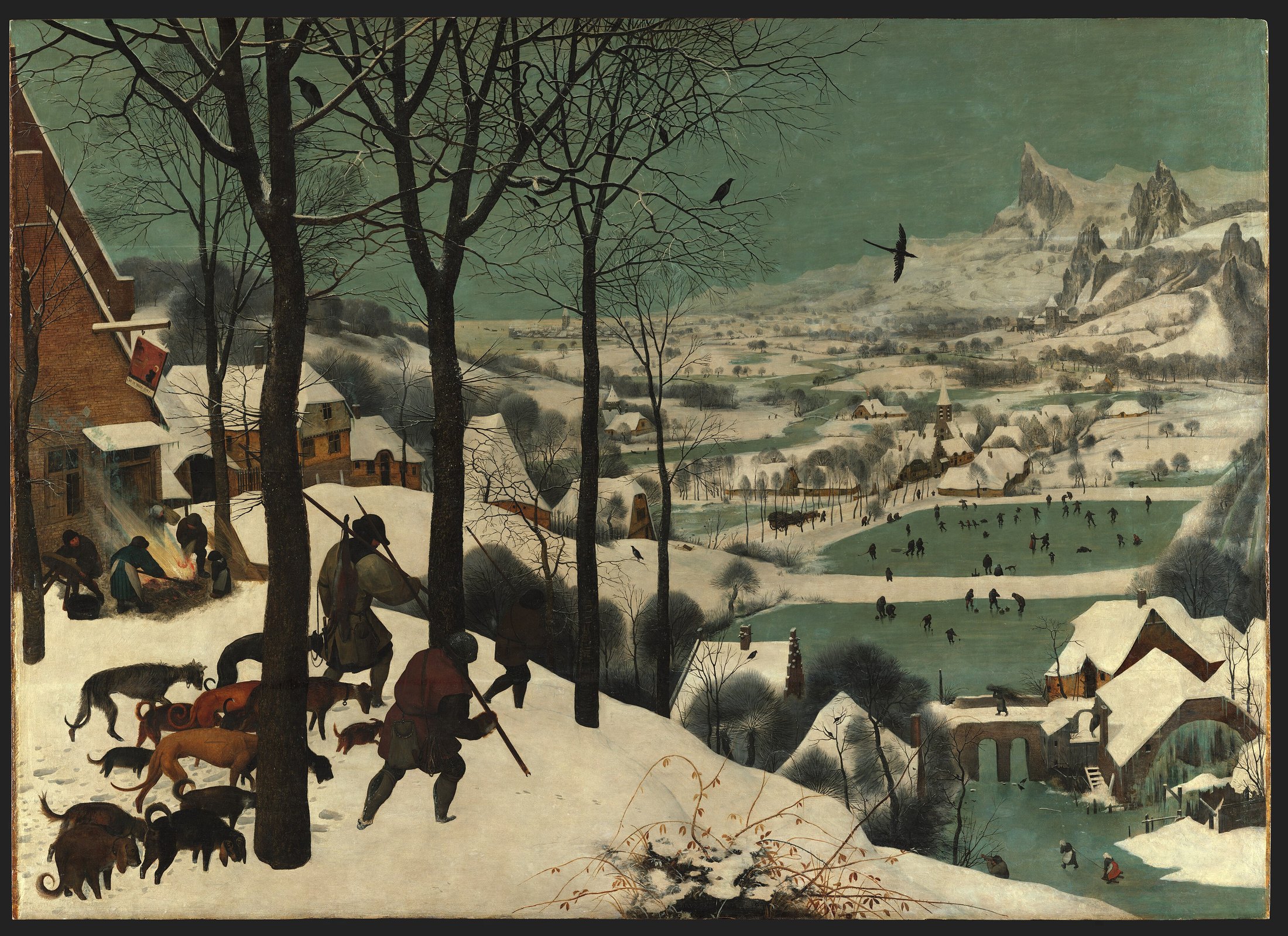 Three hunters and their dogs descend a snowy slope toward a frozen village and distant mountains